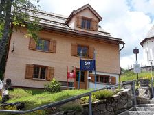 Kulisse Pfarrhof - FIS Skimuseum Damüls